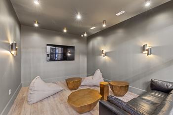 a living room with couches and tables and a television at Hadley Place Apartments, Pennsylvania